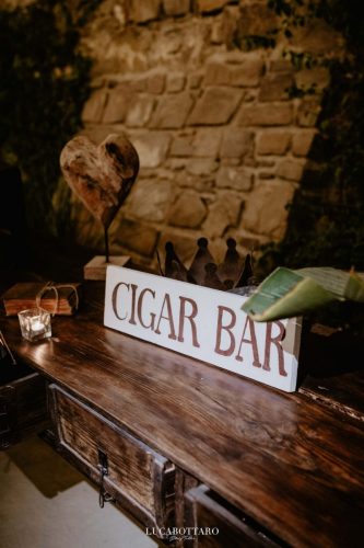Cake cutting ceremony at Castello di Rocca Cilento with panoramic night view.