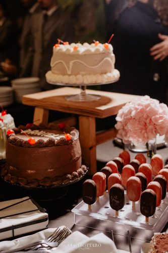 Cake cutting ceremony at Castello di Rocca Cilento with panoramic night view.