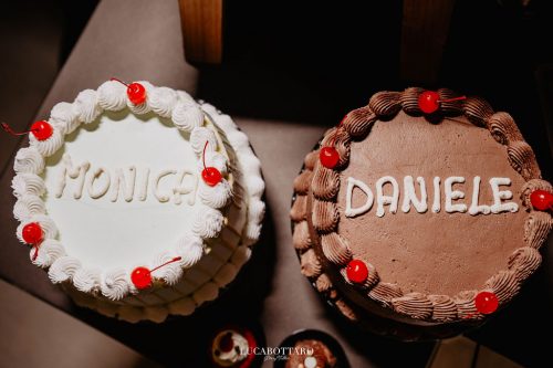 Cake cutting ceremony at Castello di Rocca Cilento with panoramic night view.