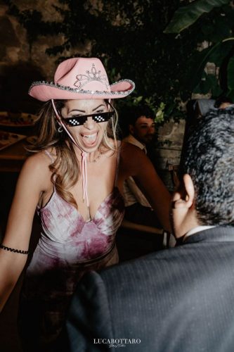 Cake cutting ceremony at Castello di Rocca Cilento with panoramic night view.