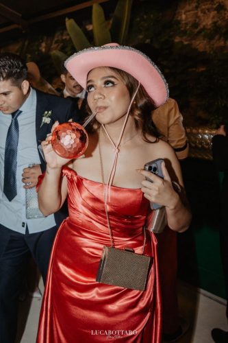 Cake cutting ceremony at Castello di Rocca Cilento with panoramic night view.
