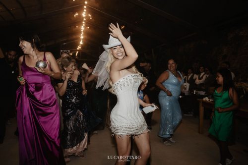 Cake cutting ceremony at Castello di Rocca Cilento with panoramic night view.